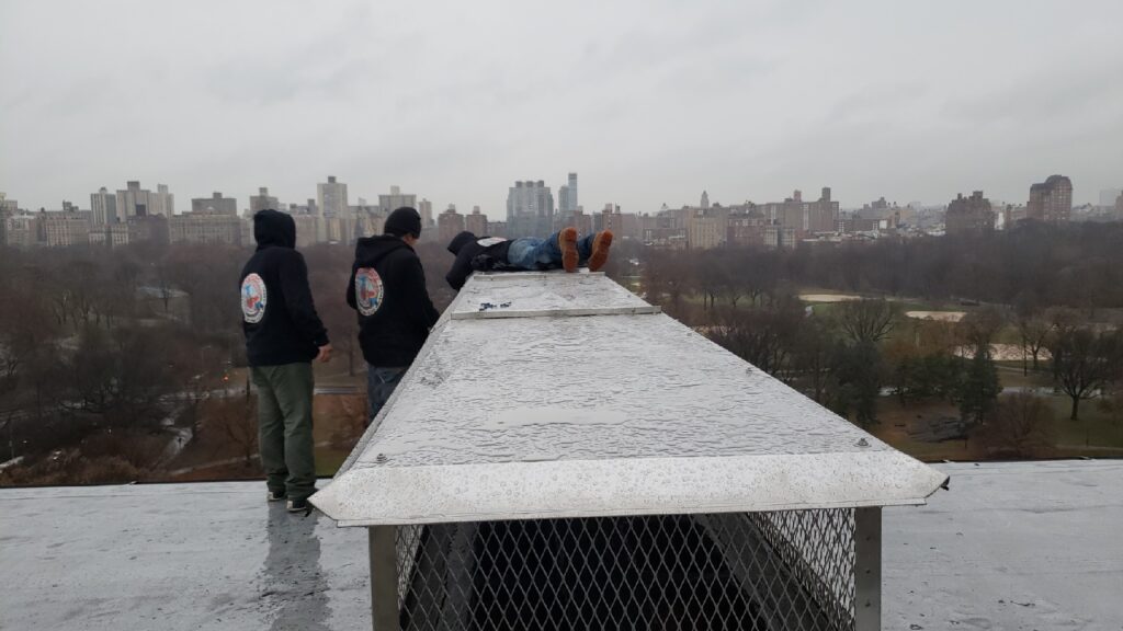 Mr Chimney Chimney Cleaning, Chimney Repairs & Chimney Inspections Chimney experts working on the chimney top.